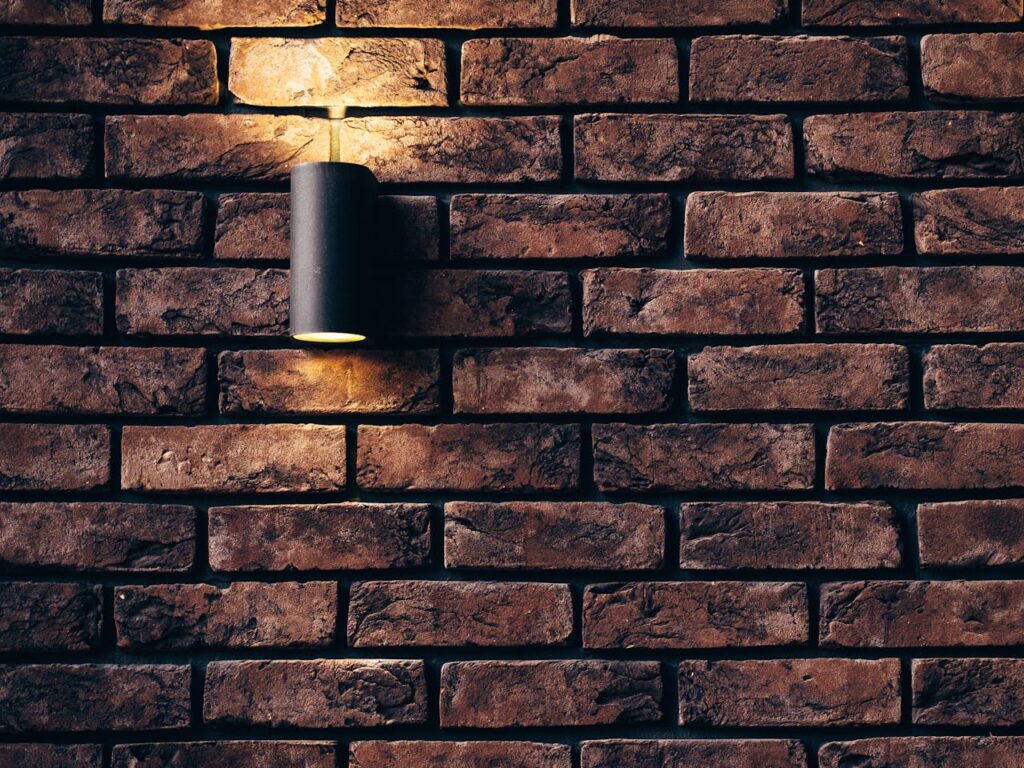 Contemporary brick wall design featuring a sleek accent light.